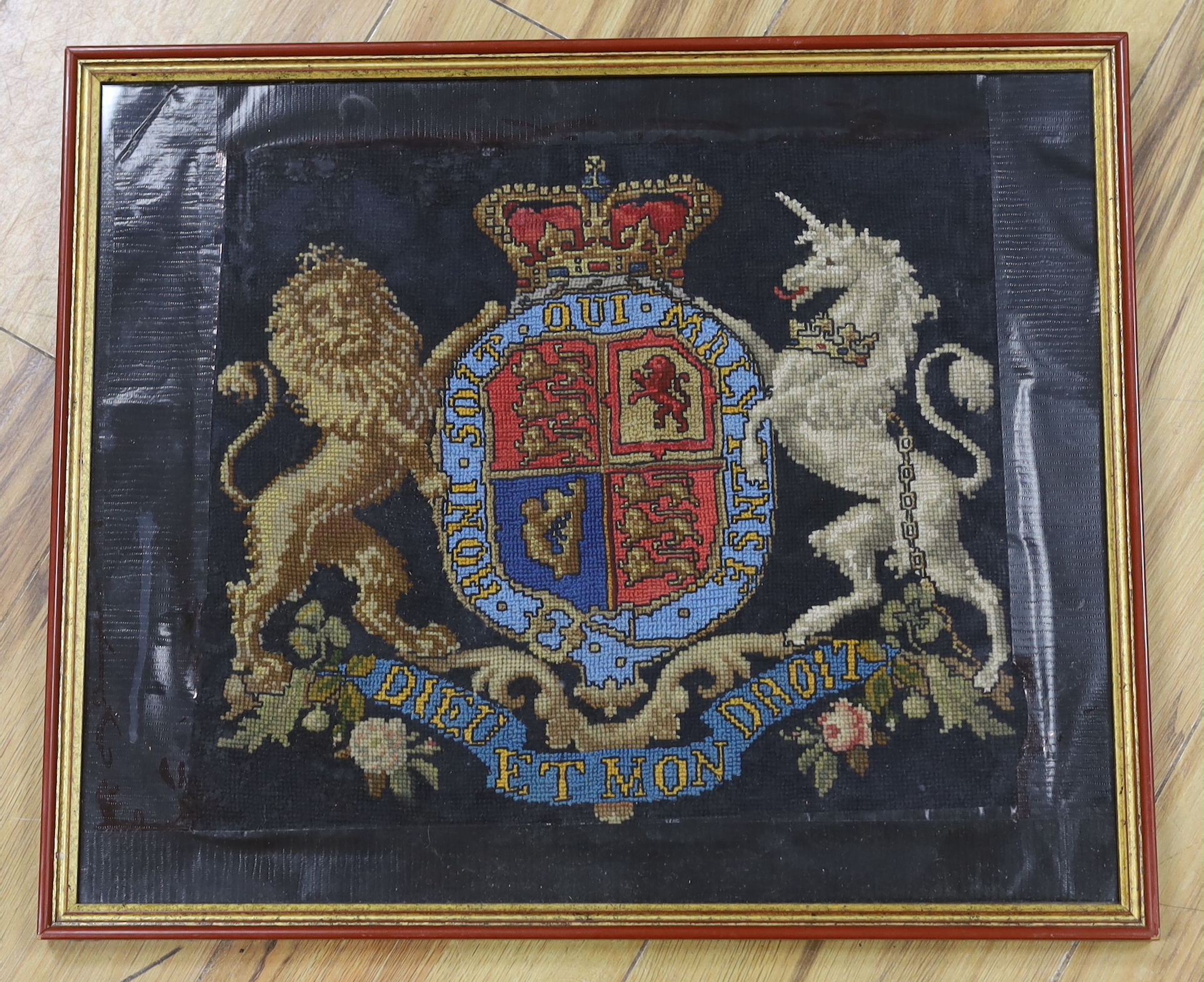 A Victorian wool worked panel of The Royal Coat Of Arms, 34cm wide x 30cm high